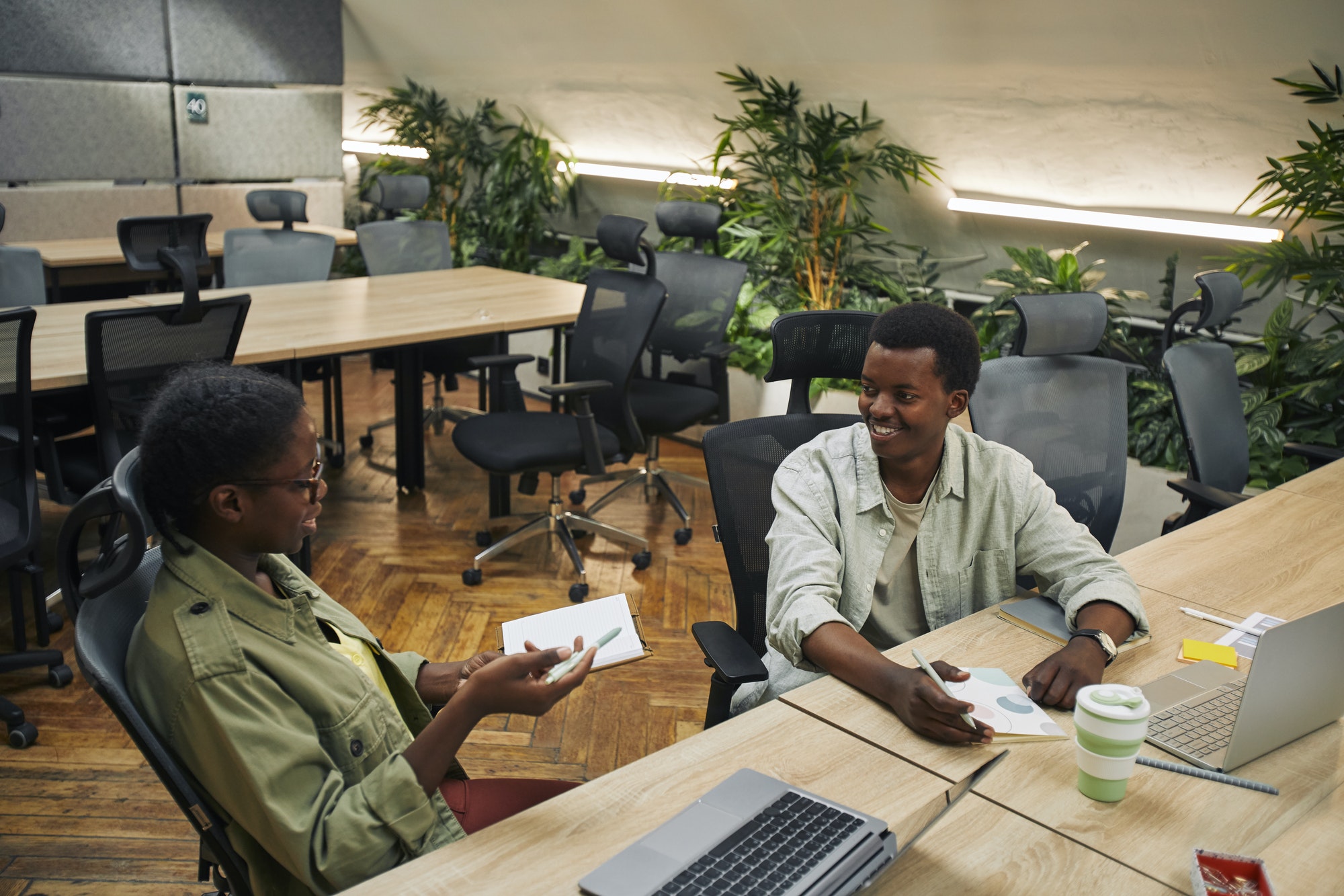 Cheerful African-American People Chatting in Office